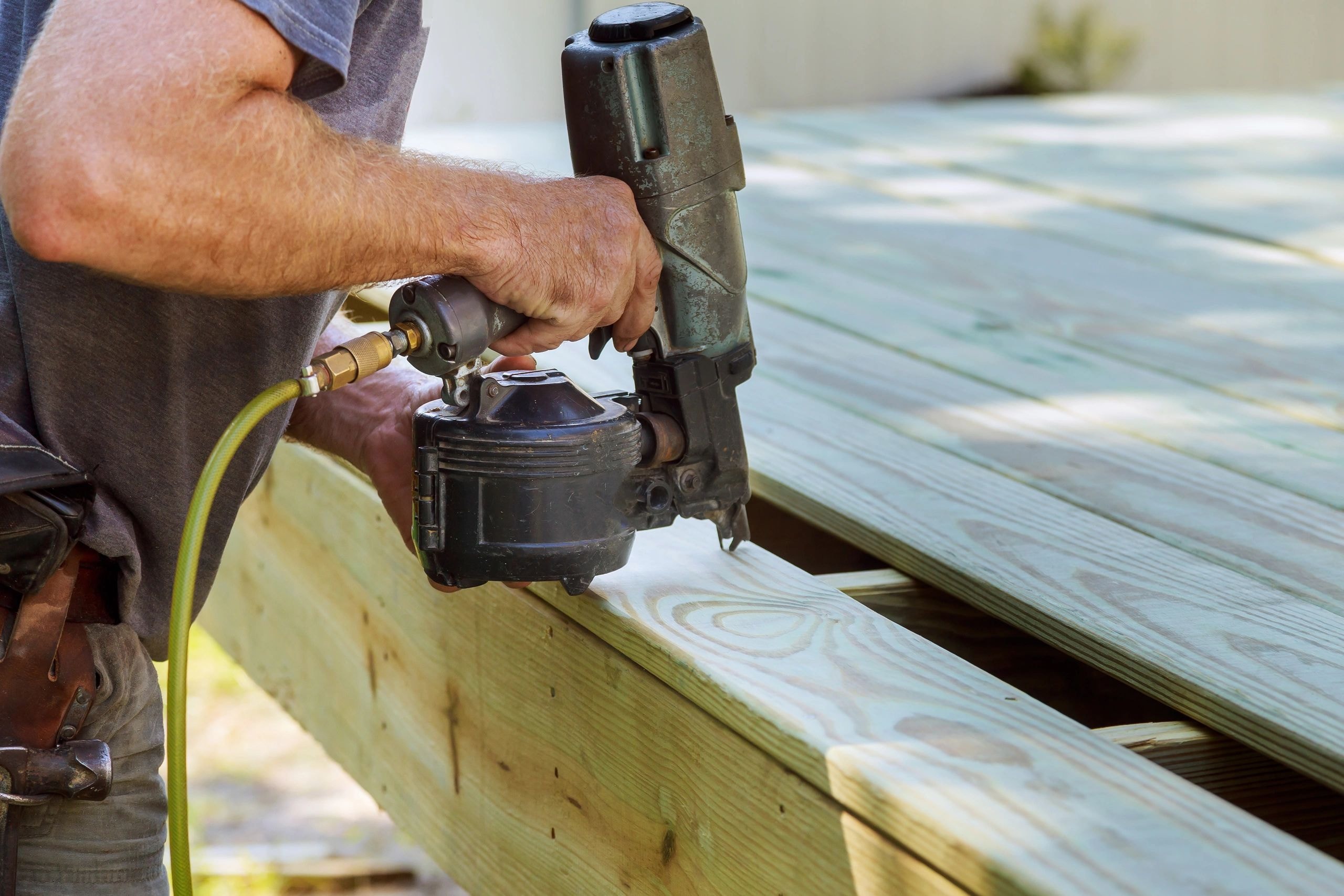 Deck Pros Plus craftsman working on deck construction