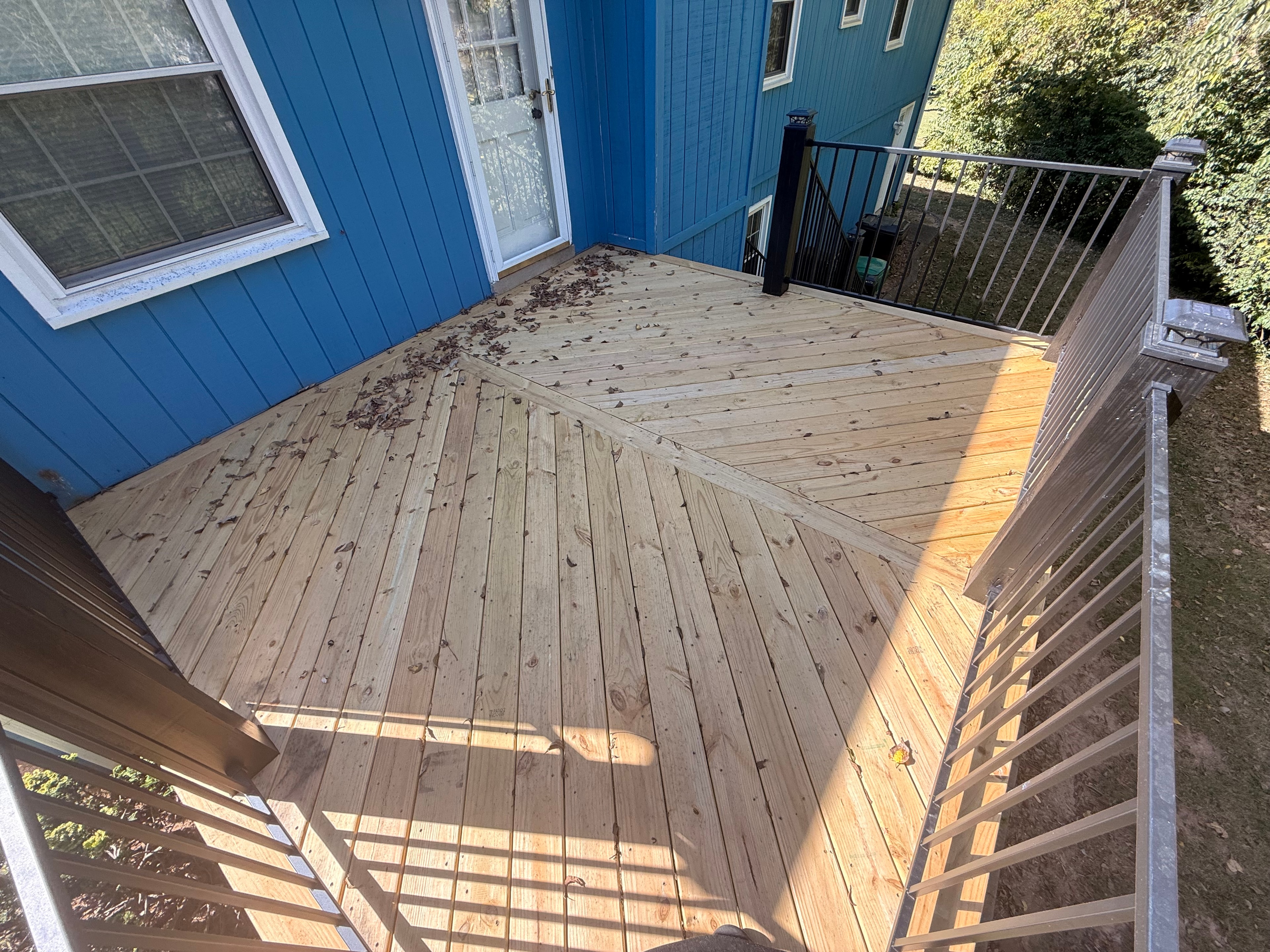 Modern deck with black metal railings — Deck Pros Plus project